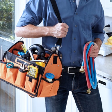 Worker with his tools — Plumbing & Solar Panel Installation in East Lismore, NSW Worker with his tools — Plumbing & Solar Panel Installation in East Lismore, NSW