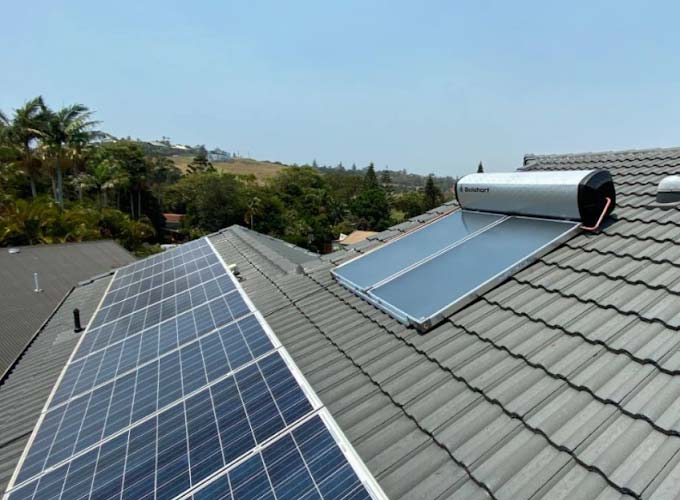 Solar Panels And Water Heater Installed On The Roof